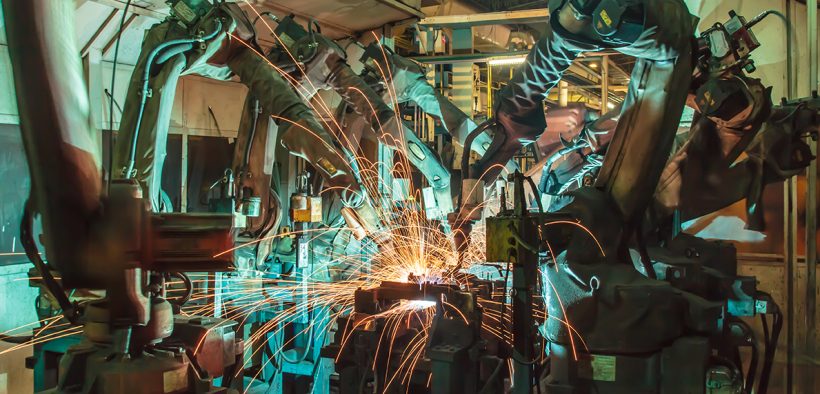 Image of robots welding in a factory for Robots as a Social Solution or a Social Disruption in Asia blog post