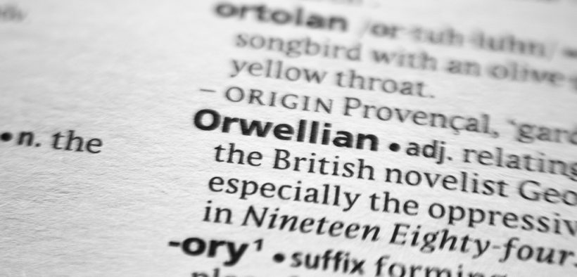 A dictionary entry for the word "Orwellian" with a blur around the word "Orwellian"